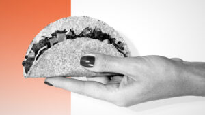 Woman holding a taco