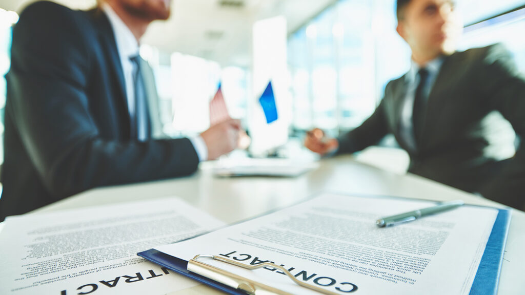 two men discussing contract